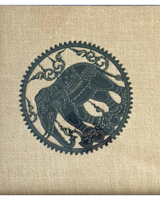 An artisan hand made Thai artist cut leather elephant embroidered on weaved hemp