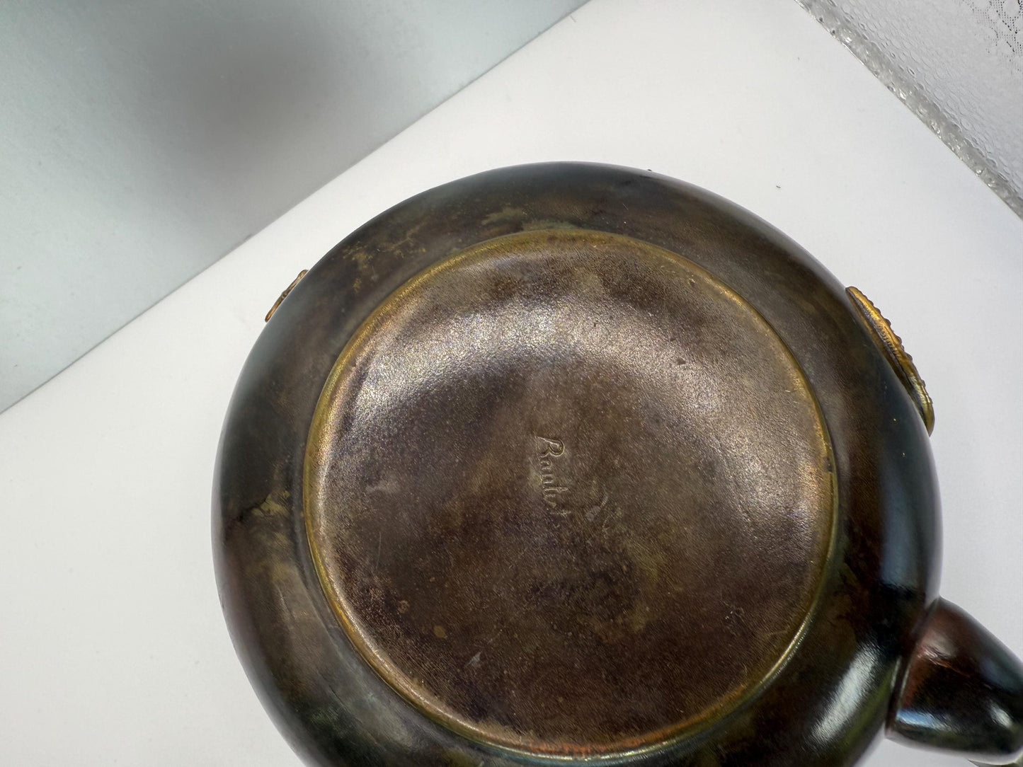 A cooper bronze vintage tea kettle with bats and moons wooden handle