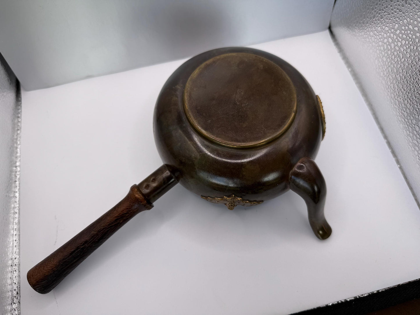 A cooper bronze vintage tea kettle with bats and moons wooden handle