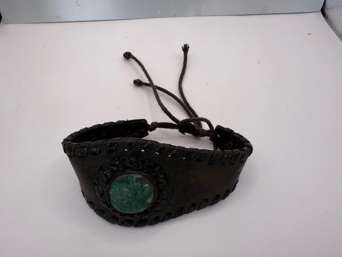 A hand made artisan bohemian thick cuff leather bracelet with green turquoise