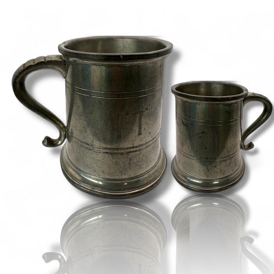 A vintage solid pewter pint cup with handle 19th century American mug