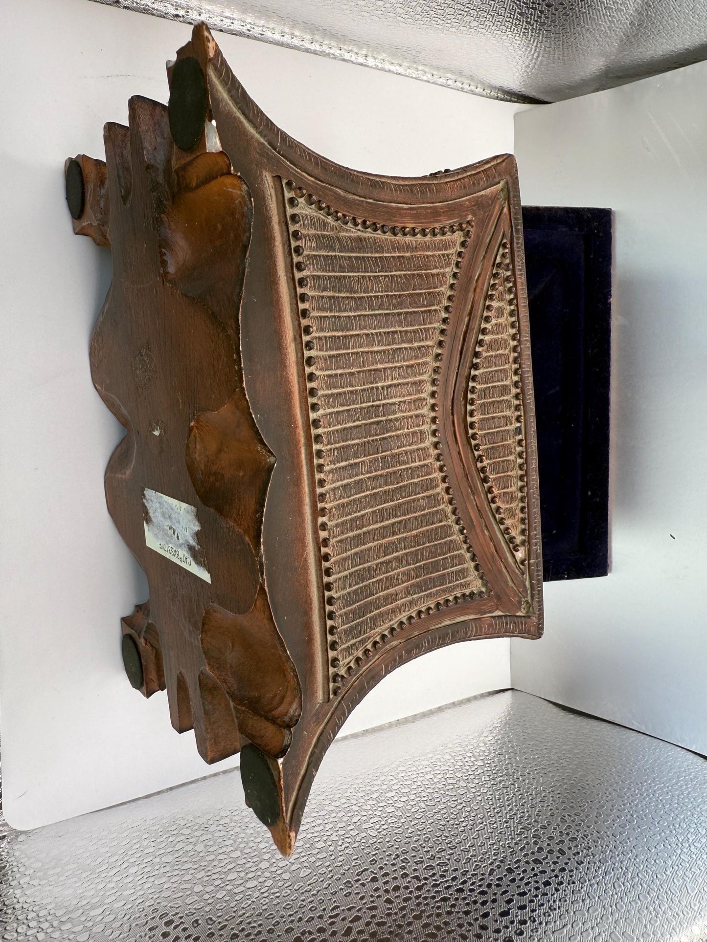 A vintage wooden oriental style jewelry box with suede lined inside interior