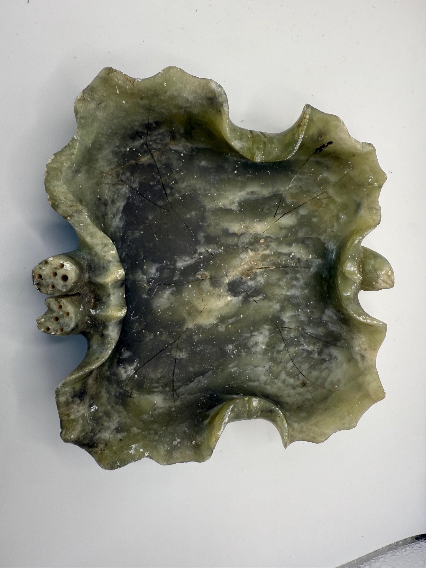 An old hand carved natural green jade ashtray with dice
