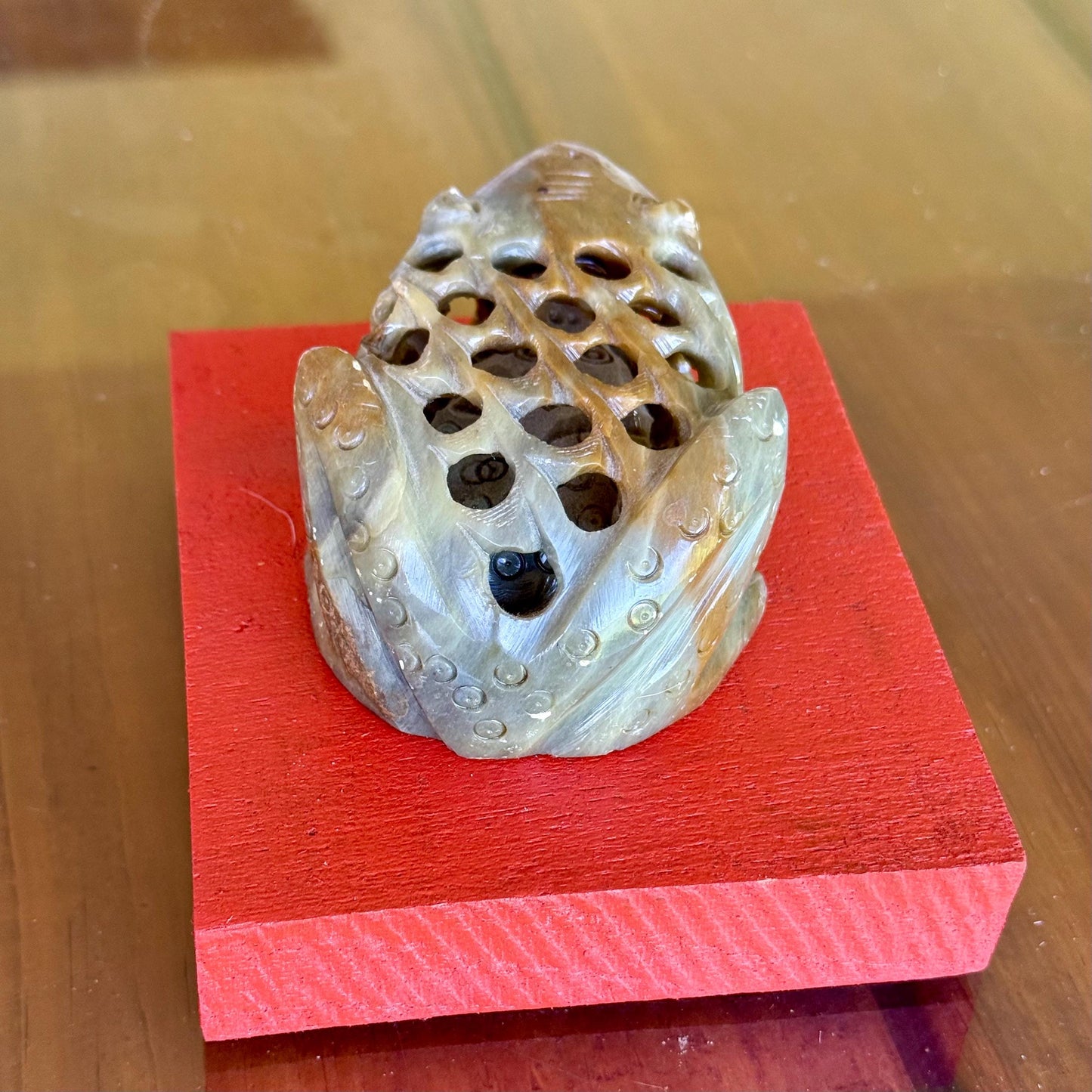 A Hand Carved Soap Stone Frog Inside Frog Art Paperweight