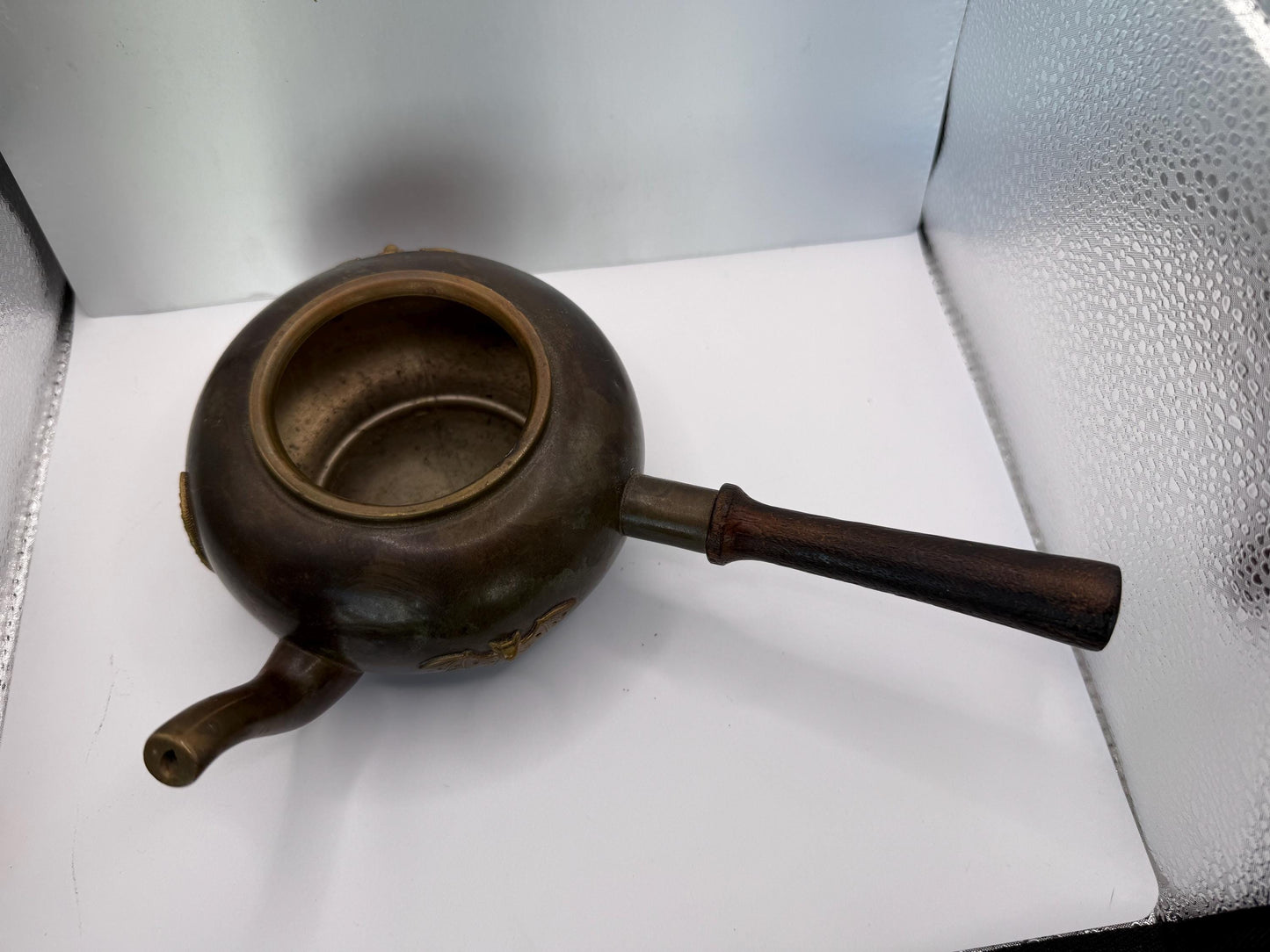A cooper bronze vintage tea kettle with bats and moons wooden handle